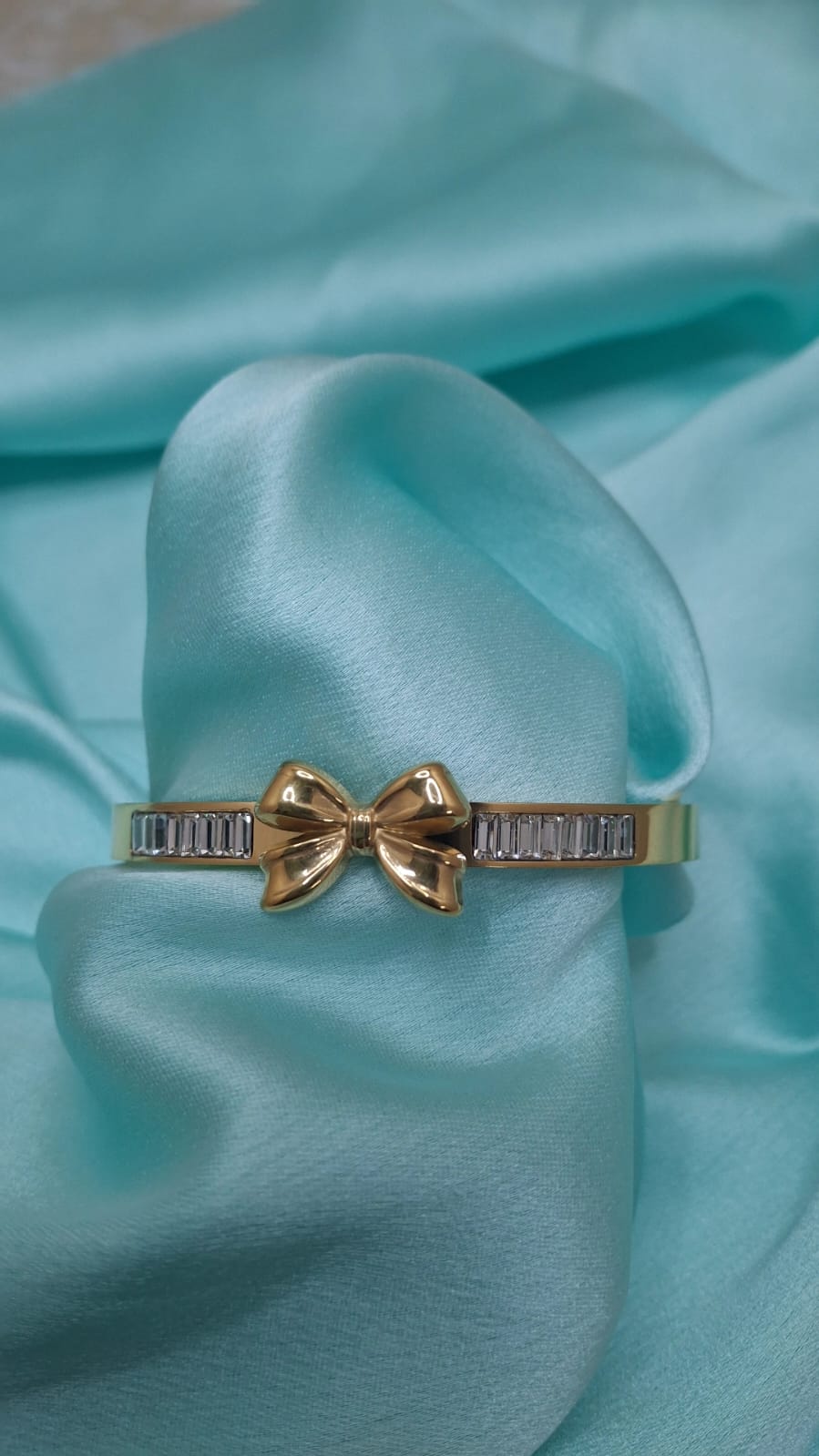 AD STUDDED BOW BRACELET
